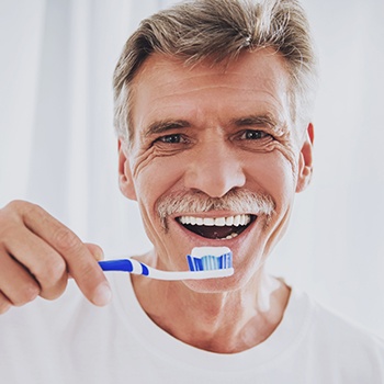 Man brushing teeth