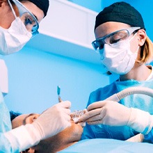 Dentists performing surgery