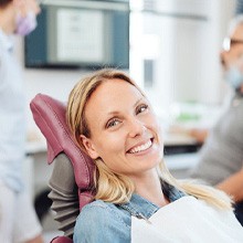 Woman smiling in the dental chair