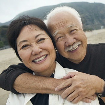 happy elderly couple in nature 