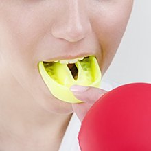 person wearing a yellow mouthguard 