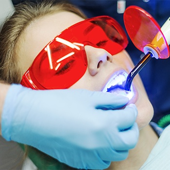 Patient receiving dental sealants