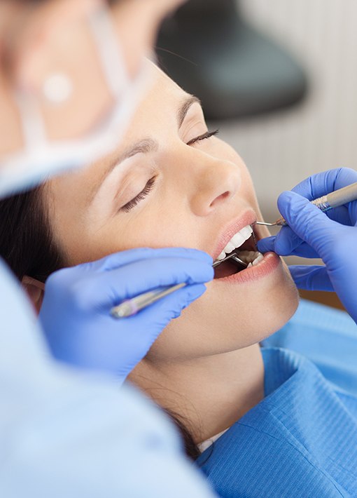 Relaxed woman receiving dental treatment