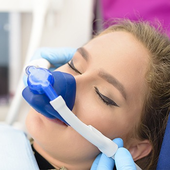 Woman with nitrous oxide nose mask