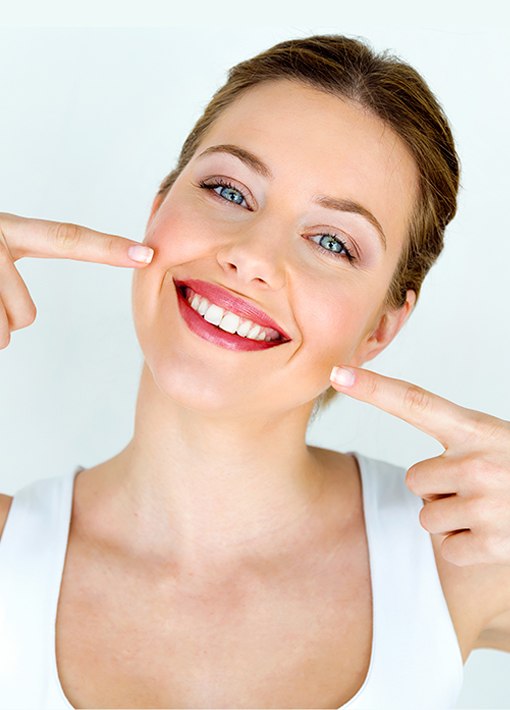 Woman pointing to beautiful smile