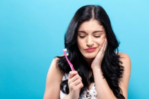 Woman with bad toothbrushing habits