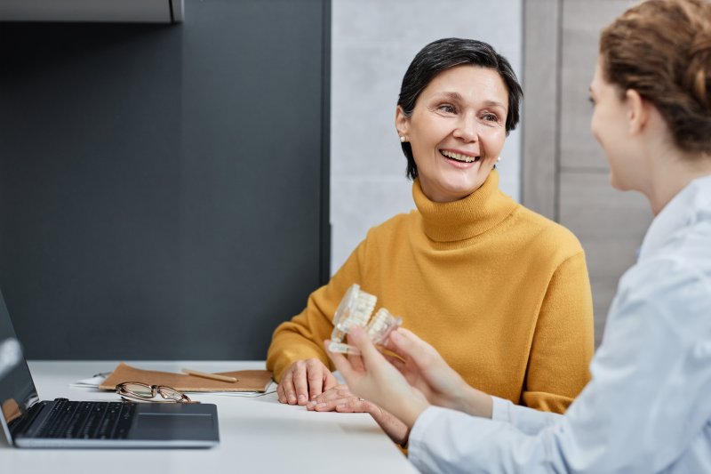 Patient talking to dentist about dental implants